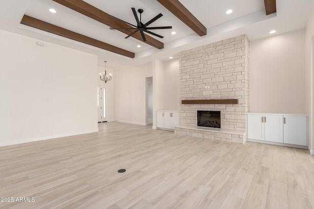 1645 E Minton St, Mesa, AZ 85203 - unfurnished living room with beam ceiling, light wood-type flooring, a fireplace, and ceiling fan with notable chandelier