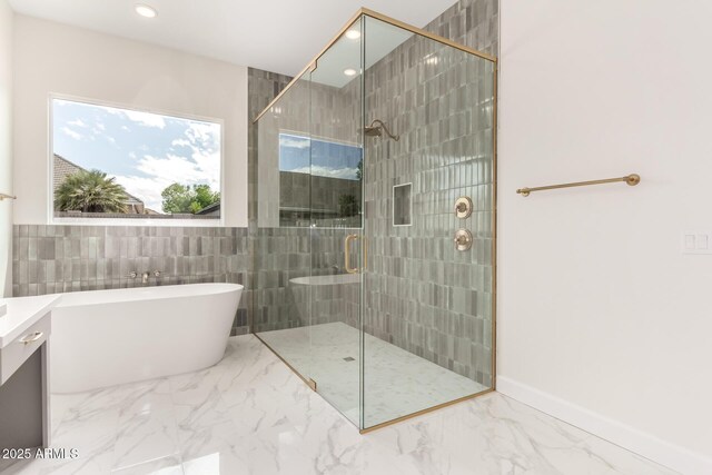1645 E Minton St, Mesa, AZ 85203 - full bathroom featuring a stall shower, a freestanding tub, marble finish floor, and recessed lighting