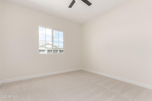 1645 E Minton St, Mesa, AZ 85203 - unfurnished room with baseboards, a ceiling fan, and light colored carpet
