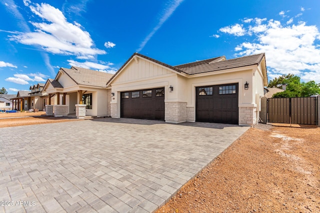 1645 E Minton St, Mesa, AZ 85203 - view of front of house featuring cooling unit, decorative driveway, an attached garage, a tile roof, and a gate