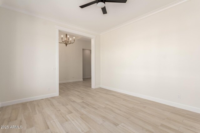 1645 E Minton St, Mesa, AZ 85203 - unfurnished room with ornamental molding, baseboards, light wood-style floors, and ceiling fan with notable chandelier