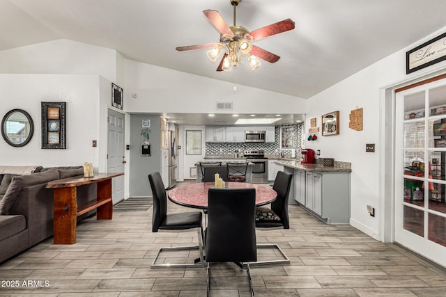 4013 E Delta Cir, Mesa, AZ 85206 - dining space with vaulted ceiling, ceiling fan, and light wood-type flooring