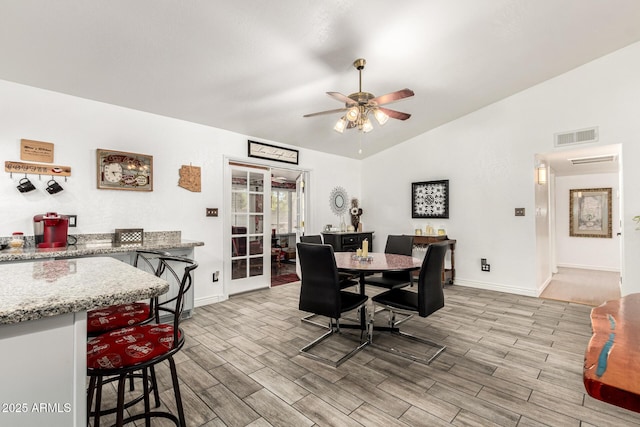 4013 E Delta Cir, Mesa, AZ 85206 - dining room featuring light wood finished floors, vaulted ceiling, and a ceiling fan