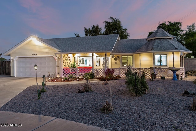4013 E Delta Cir, Mesa, AZ 85206 - view of front of home with covered porch, concrete driveway, a garage, and a shingled roof