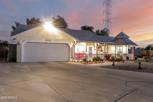 4013 E Delta Cir, Mesa, AZ 85206 - view of front facade with driveway, an attached garage, a porch, and a shingled roof