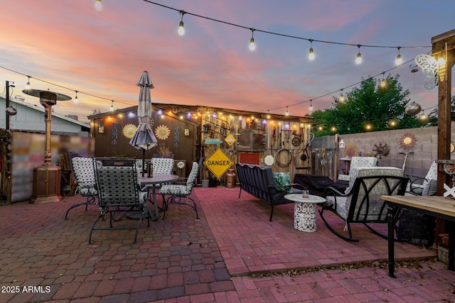 4013 E Delta Cir, Mesa, AZ 85206 - patio terrace at dusk with a patio, a fenced backyard, and outdoor dining area