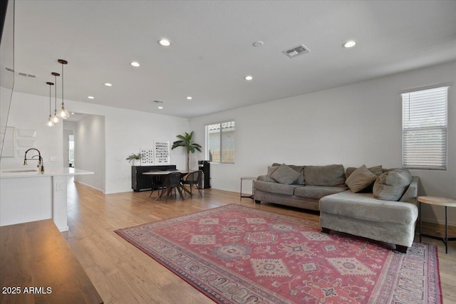 6313 N 68th Dr, Glendale, AZ 85303 - living area featuring recessed lighting and light wood-style flooring