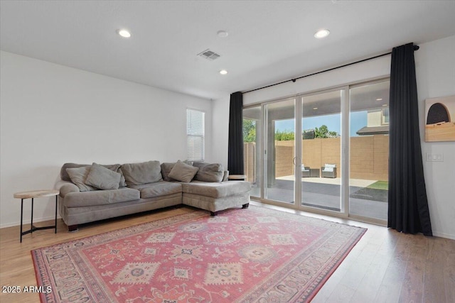 6313 N 68th Dr, Glendale, AZ 85303 - living area featuring light wood finished floors and recessed lighting