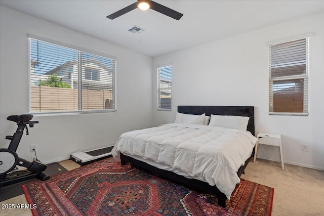 6313 N 68th Dr, Glendale, AZ 85303 - carpeted bedroom with a ceiling fan and baseboards