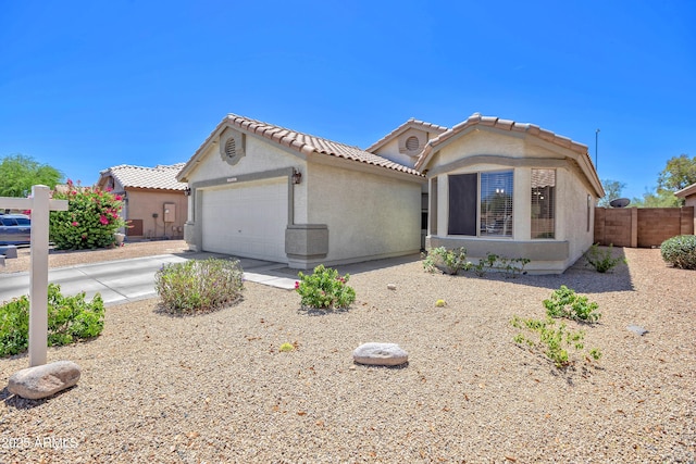 10951 E Delta Ave, Mesa, AZ 85208 - view of front of house with an attached garage, stucco siding, a tile roof, and concrete driveway