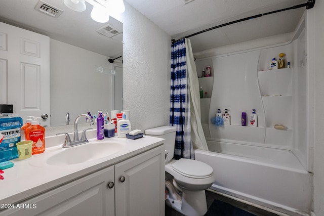 full bathroom featuring vanity, shower / bath combination with curtain, and toilet