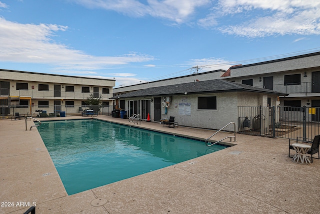 view of swimming pool with a patio area