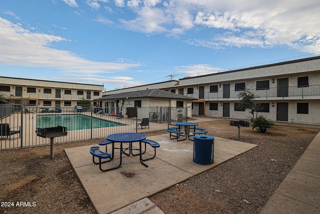 exterior space featuring a patio and a pool