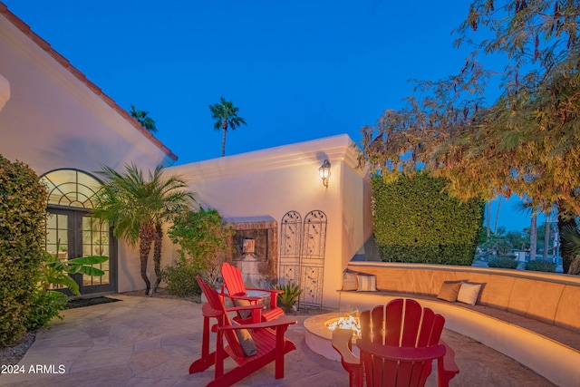 view of patio terrace at dusk