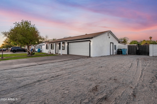 single story home featuring a garage