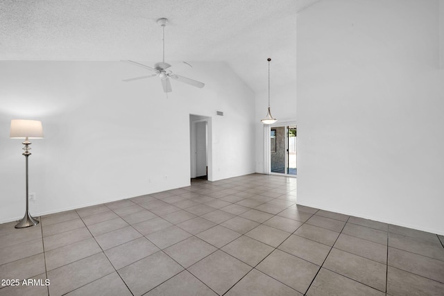 unfurnished living room with a textured ceiling, ceiling fan, tile patterned floors, and high vaulted ceiling