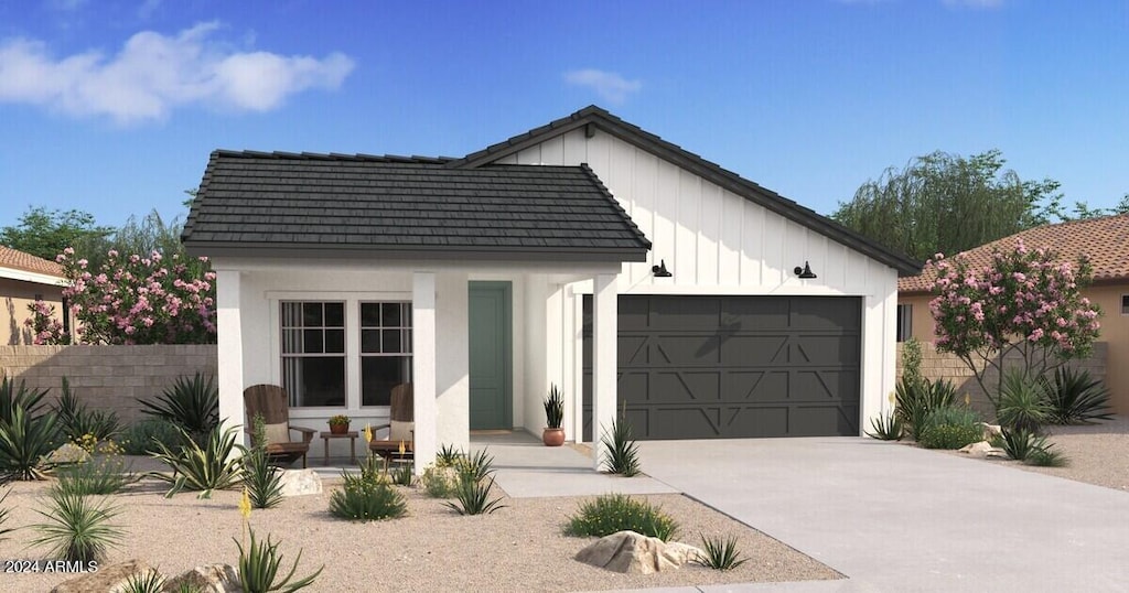 modern inspired farmhouse with a garage