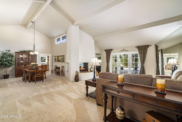 carpeted living room featuring vaulted ceiling with beams and a multi sided fireplace