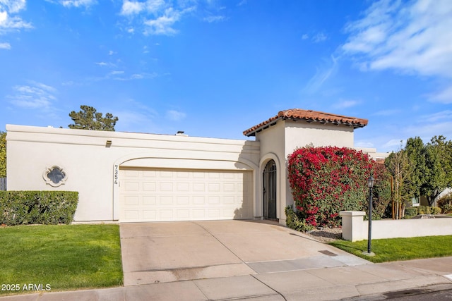 view of front of house with a garage and a front lawn