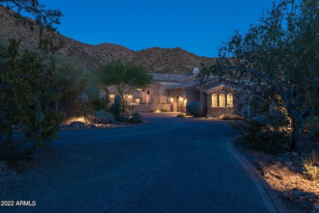 view of front of property with a mountain view