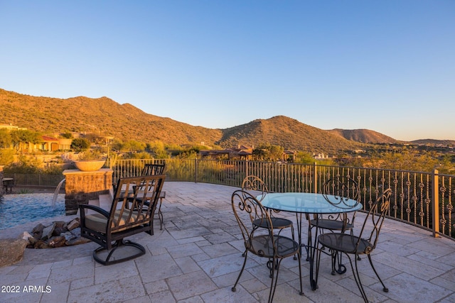 view of patio / terrace with a mountain view