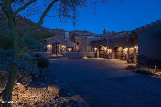 mediterranean / spanish house featuring a mountain view