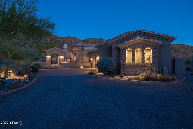 mediterranean / spanish home featuring a mountain view