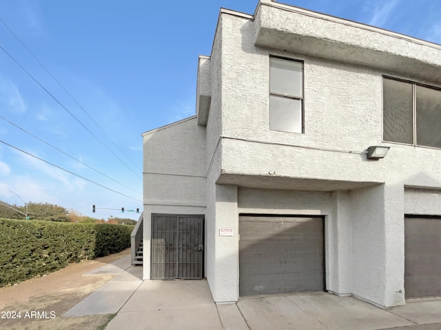 view of property exterior featuring a garage