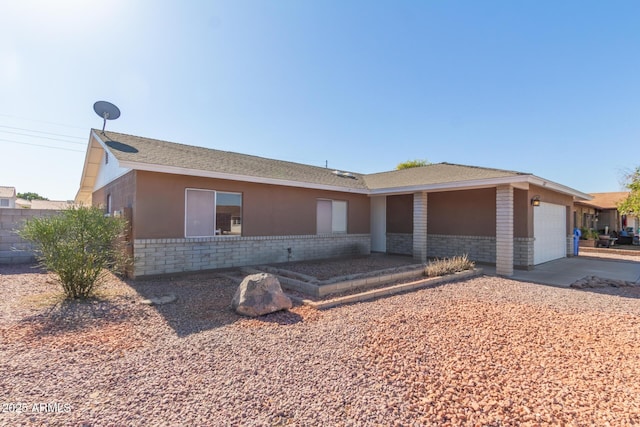 ranch-style home featuring a garage