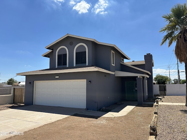 121 N Brown Ave, Casa Grande, AZ 85122 - view of front of property with stucco siding, an attached garage, concrete driveway, and a chimney