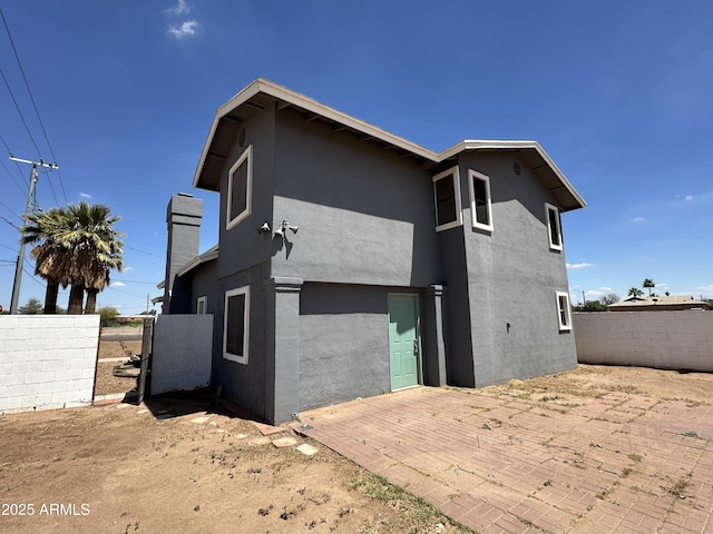 121 N Brown Ave, Casa Grande, AZ 85122 - rear view of house with stucco siding and a patio area