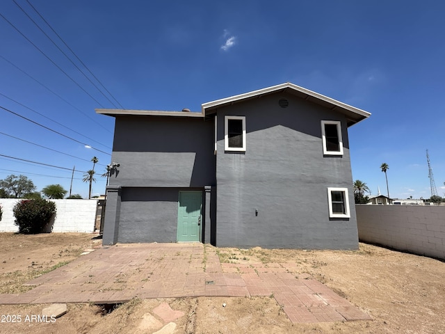 121 N Brown Ave, Casa Grande, AZ 85122 - back of house with stucco siding, a fenced backyard, and a patio