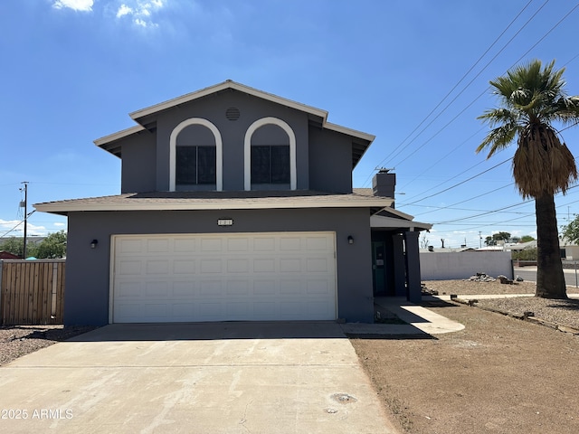 121 N Brown Ave, Casa Grande, AZ 85122 - traditional-style home with stucco siding, concrete driveway, an attached garage, and a chimney