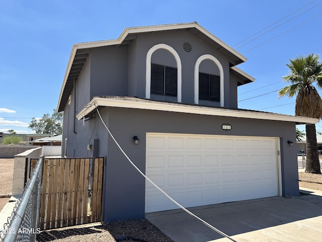 121 N Brown Ave, Casa Grande, AZ 85122 - view of front of property with stucco siding, a gate, an attached garage, and driveway