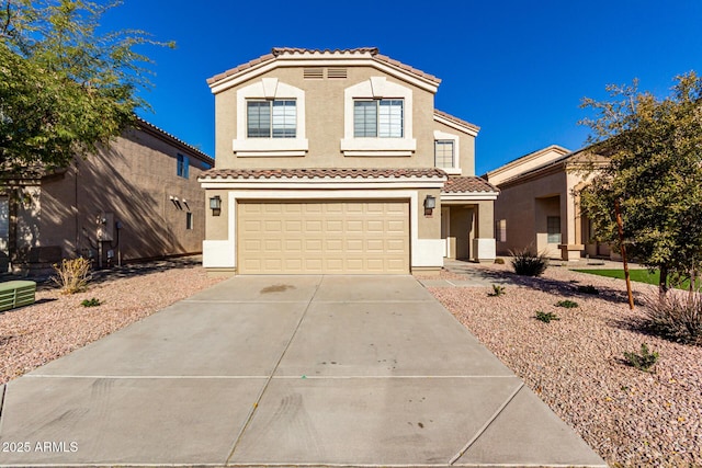 mediterranean / spanish-style home with a garage