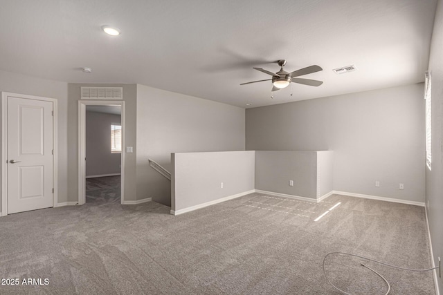 unfurnished room with carpet floors and ceiling fan