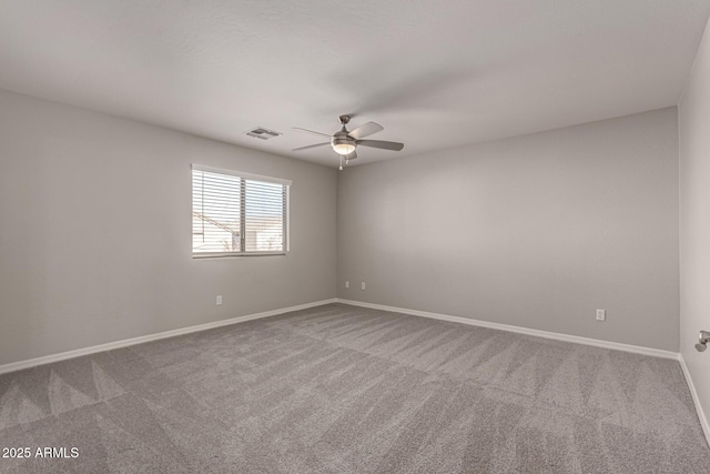 empty room with carpet floors and ceiling fan