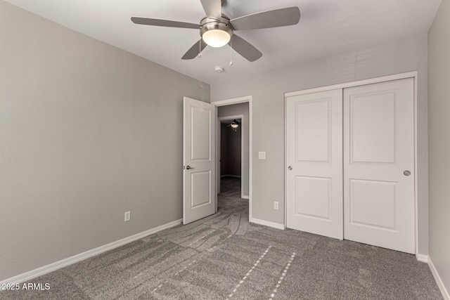 unfurnished bedroom featuring carpet flooring, a closet, and ceiling fan