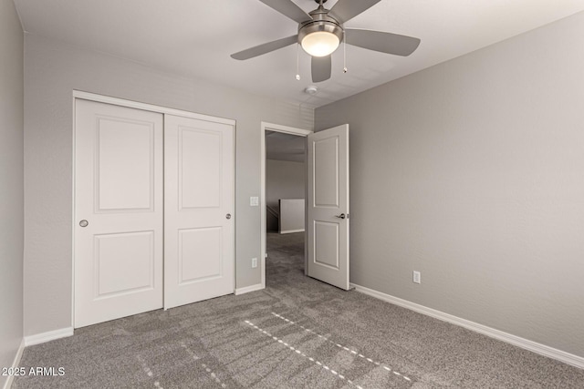 unfurnished bedroom with a closet, ceiling fan, and carpet floors