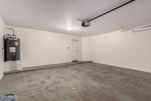 garage with a garage door opener and electric water heater