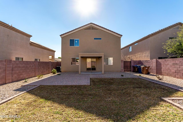 rear view of property with cooling unit, a patio, and a lawn