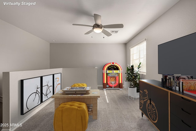 playroom with ceiling fan and carpet flooring