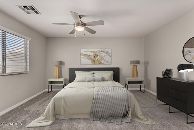 bedroom featuring ceiling fan and carpet