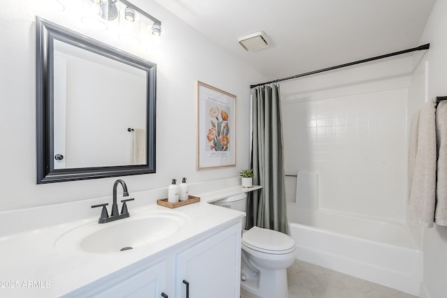 full bathroom with tile patterned flooring, shower / tub combo, vanity, and toilet