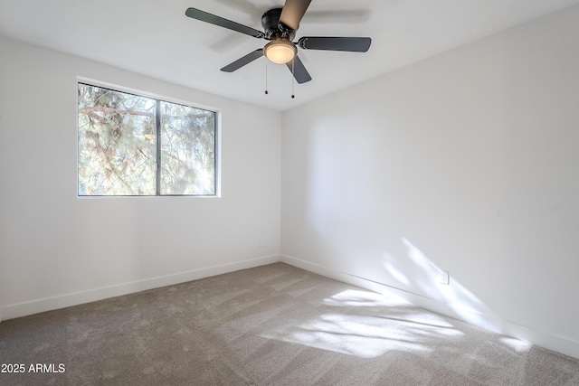 spare room with carpet flooring and ceiling fan