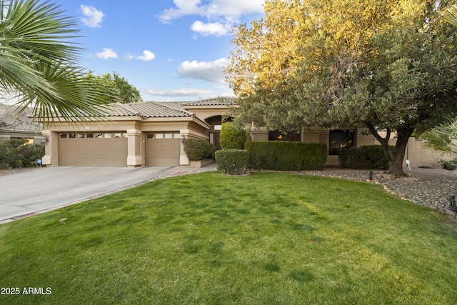 view of front of house with a garage and a front yard