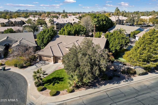 birds eye view of property featuring a mountain view