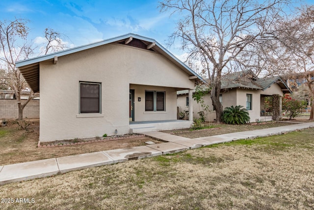 view of front of property with a front lawn