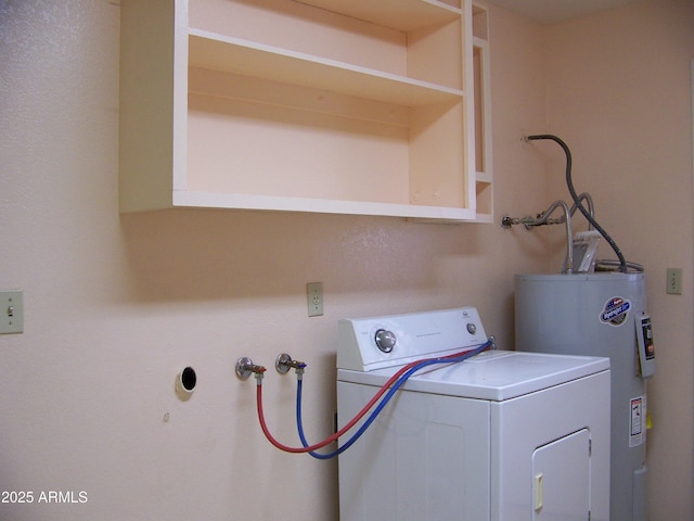 clothes washing area with washer / dryer, laundry area, and water heater