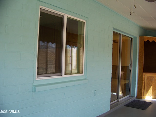 exterior space with concrete block siding